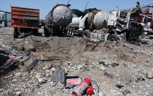 A crater is seen next to destroyed trucks after Russian shelling in Rozumivka, near Zaporizhzhia, Ukraine, June 20, 2023. (AP Photo/Andriy Andriyenko) A crater is seen next to destroyed trucks after Russian shelling in Rozumivka, near Zaporizhzhia, Ukraine, June 20, 2023. (AP Photo/Andriy Andriyenko)