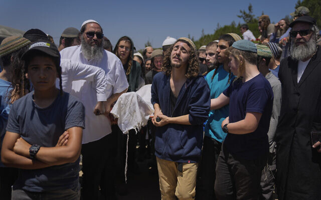 Mourners carry the body of terror victim Nachman Mordoff, 17, during his funeral in the West Bank settlement of Shilo, June 21, 2023 (AP Photo/Ohad Zwigenberg) Mourners carry the body of terror victim Nachman Mordoff, 17, during his funeral in the West Bank settlement of Shilo, June 21, 2023 (AP Photo/Ohad Zwigenberg)