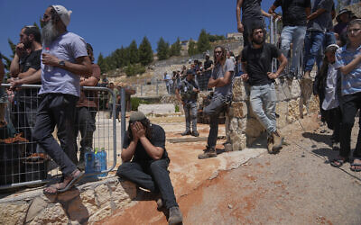 Mourners attend the funeral of Nachman Mordoff, 17, who was among four Israelis killed by two Palestinian attackers in the West Bank Israeli settlement of Shilo, Wednesday, June 21, 2023. (AP Photo/Ohad Zwigenberg) Mourners attend the funeral of Nachman Mordoff, 17, who was among four Israelis killed by two Palestinian attackers in the West Bank Israeli settlement of Shilo, Wednesday, June 21, 2023. (AP Photo/Ohad Zwigenberg)