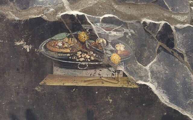 The wall of an ancient Pompeian house with a fresco depicting a table with food, but not pizza, June 27, 2023. (Pompeii Archaeological Park via AP, ho) The wall of an ancient Pompeian house with a fresco depicting a table with food, but not pizza, June 27, 2023. (Pompeii Archaeological Park via AP, ho)