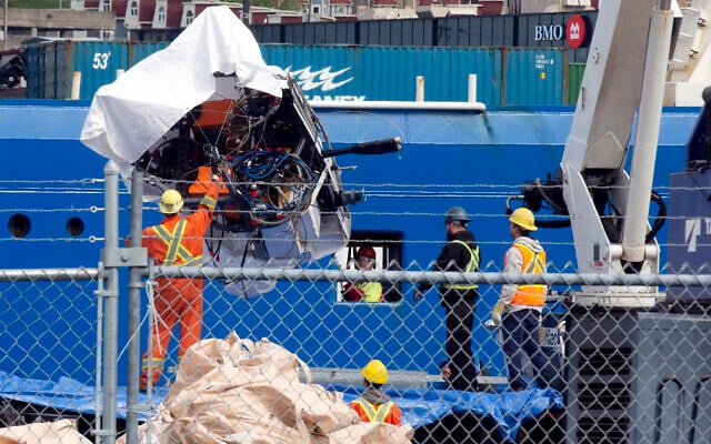 Debris from the Titan submersible, recovered from the ocean floor near the wreck of the Titanic, is unloaded from the ship Horizon Arctic at the Canadian Coast Guard pier in St. John's, Newfoundland, Wednesday, June 28, 2023. (Paul Daly/The Canadian Press via AP) Debris from the Titan submersible, recovered from the ocean floor near the wreck of the Titanic, is unloaded from the ship Horizon Arctic at the Canadian Coast Guard pier in St. John's, Newfoundland, Wednesday, June 28, 2023. (Paul Daly/The Canadian Press via AP)