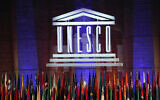 The logo of the United Nations Educational, Scientific and Cultural Organization (UNESCO) is seen during the 39th session of the General Conference at the UNESCO headquarters in Paris, Nov. 4, 2017. (AP Photo/Christophe Ena, File)