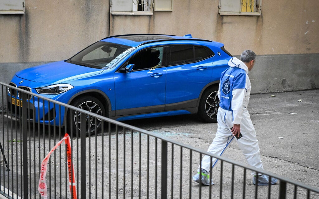 Police at the scene where a woman was shot and killed while sitting in her car in Haifa, May 8, 2023. (Flash90) Police at the scene where a woman was shot and killed while sitting in her car in Haifa, May 8, 2023. (Flash90)