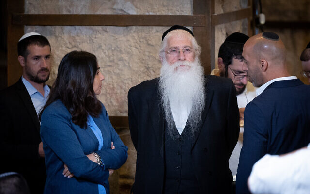 Minister of Jerusalem Affairs and Jewish Heritage Meir Porush, center, in Jerusaelm on May 21, 2023. (Yonatan Sindel/Flash90) Minister of Jerusalem Affairs and Jewish Heritage Meir Porush, center, in Jerusaelm on May 21, 2023. (Yonatan Sindel/Flash90)