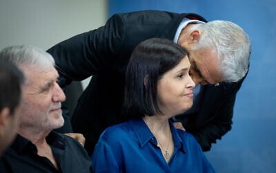 Yesh Atid MK Yair Lapid (R) speaks with MK Karine Elharrar (C) during a Yesh Atid Knesset faction meeting, May 29, 2023. (Yonatan Sindel/Flash90)