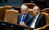 Prime Minister Benjamin Netanyahu, left, with Justice Minister Yariv Levin at the Knesset in Jerusalem, on June 7, 2023. (Oren Ben Hakoon/Flash90)