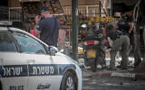 Illustrative: Police at the scene where a motorcycle exploded in Ramat Gan, on June 11, 2023. (Avshalom Sassoni/Flash90)