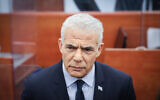 Opposition leader Yair Lapid at Prime Minister Benjamin Netanyahu's corruption trial at the District Court in Jerusalem on June 12, 2023. (Yonatan Sindel/Flash90)