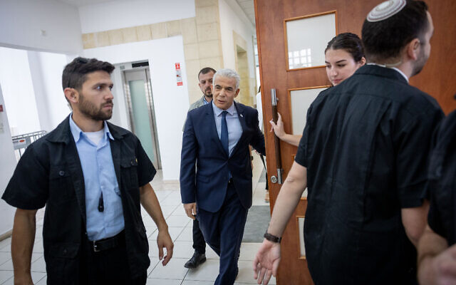 Opposition leader Yair Lapid arrives at the Jerusalem District Court to testify in Prime Minister Benjamin Netanyahu's graft trial on June 13, 2023. (Yonatan Sindel/Flash90) Opposition leader Yair Lapid arrives at the Jerusalem District Court to testify in Prime Minister Benjamin Netanyahu's graft trial on June 13, 2023. (Yonatan Sindel/Flash90)