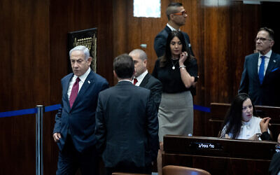 Prime Minister Benjamin Netanyahu attends a vote on the judicial selection panel in the Knesset, June 14, 2023. Tally Gotliv MK is seated at right. (Yonatan Sindel/Flash90)