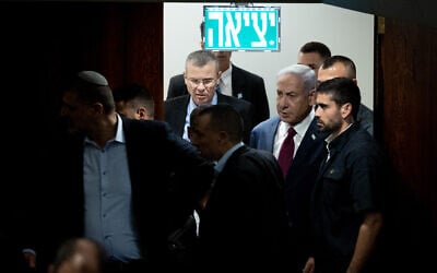 Prime Minister Benjamin Netanyahu (right) and Justice Minister Yariv Levin arrive to vote on the judicial selection panel in the Knesset, June 14, 2023. (Yonatan Sindel/Flash90)
