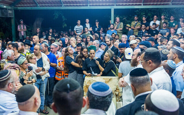 Friends and family attend the funeral of 21-year-old Harel Masood, who was killed in a terror attack near the West Bank settlement of Eli, at the cemetery in Yesodot, on June 20, 2023. (Liron Moldovan/Flash90) Friends and family attend the funeral of 21-year-old Harel Masood, who was killed in a terror attack near the West Bank settlement of Eli, at the cemetery in Yesodot, on June 20, 2023. (Liron Moldovan/Flash90)