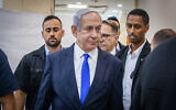 Prime Minister Benjamin Netanyahu arrives at the District Court in Jerusalem to listen to the testimony of businessman Arnon Milchan in the prime minister's corruption trial on June 25, 2023. (Oren Ben Hakoon/POOL)