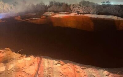 A screen grab from video that shows a crater in the ground in Herzliya following a loud explosion, June 22, 2023. (Screenshot: Twitter, used in accordance with Clause 27a of the Copyright Law)