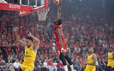 Hapoel Tel Aviv's Jordan Mcrae rises up for a dunk against Maccabi Tel Aviv in the Drive-In Arena on June 11, 2023 (Yuval Daniel/Hapoel Tel Aviv BC)