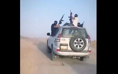 A screenshot from video of masked suspects firing into the air during a wedding procession in the southern Bedouin town of Tel Sheva, June 16, 2023. (Screenshot: Twitter; used in accordance with Clause 27a of the Copyright Law)