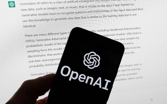 The OpenAI logo is seen on a mobile phone in front of a computer screen displaying output from ChatGPT, March 21, 2023. (AP Photo/Michael Dwyer, File) The OpenAI logo is seen on a mobile phone in front of a computer screen displaying output from ChatGPT, March 21, 2023. (AP Photo/Michael Dwyer, File)