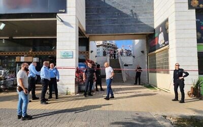 The scene in Harish where the body of an 86-year-old woman was found in the trash room of a commercial center, June 7, 2023 (Israel Police)