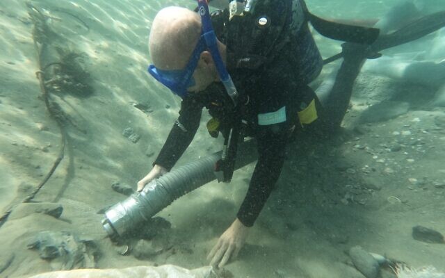 The sand dredger works as a massive vacuum cleaner and deposits the sand in another area, so the archaeologists can excavate, seen here at Dor Beach in May 2023. (courtesy Department of Maritime Civilizations/Haifa University)
