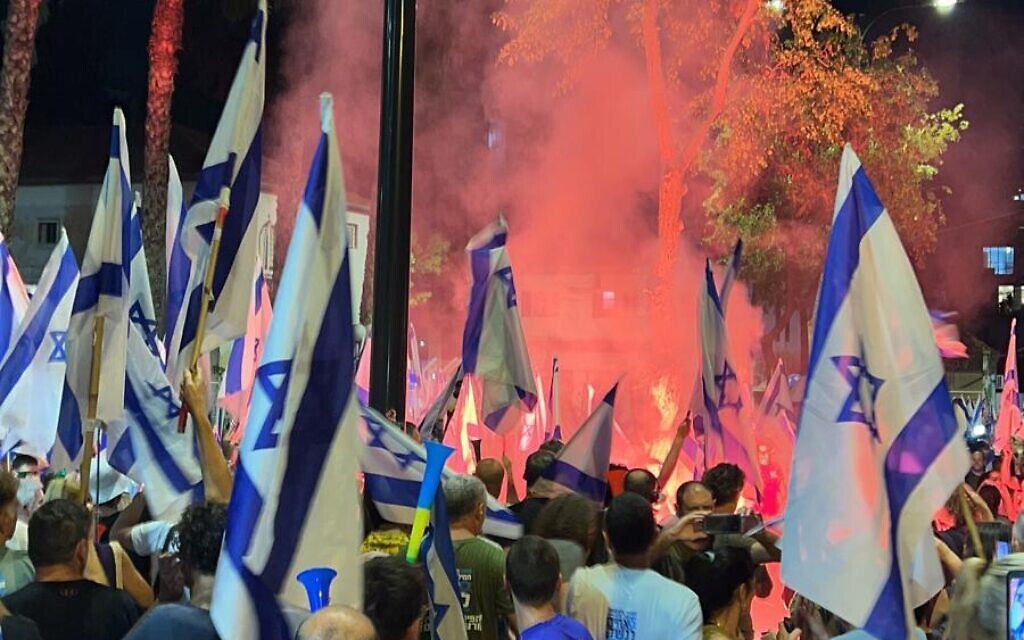 File - Protesters gather outside a Petah Tikva police station on June 26, 2023, where an anti-judicial overhaul activist was being questioned. (Brothers and Sisters in Arms)