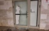 This handout photo shows a smashed glass door at the Neve Tzedek military prison in central Israel, June 30, 2023. (Israel Police)