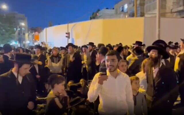 Haredi protesters against the light rail construction on Bar Ilan Street in Jerusalem, June 11, 2023. (Israel Police/ Screenshot) Haredi protesters against the light rail construction on Bar Ilan Street in Jerusalem, June 11, 2023. (Israel Police/ Screenshot)