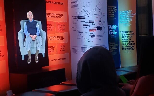 Students ask questions of 'Dimensions in Testimony' eyewitness holograms, part of  a partnership between USC Shoah Foundation and the nonprofit Common Circles, White Plains Middle School, New York, June 1, 2023 (Matt Lebovic/Times of Israel)
