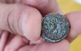 A rare bronze medium denomination coin from the reign of Antigonus Mattathias II (40 BCE - 37 BCE), allegedly illegally excavated, after they were recovered from a suspect's home in the Silwan neighborhood of East Jerusalem, June 7, 2023. (Israel Antiquities Authority)