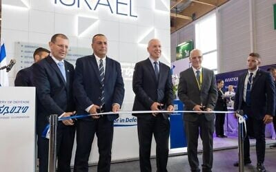 Then-defense minister Yoav Gallant (center) inaugurates Israel's national pavilion at the 2023 Paris Air Show, June 19, 2023. (Ariel Hermoni/Defense Ministry)