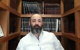 Rabbi Reuven Yaacobov speaks about the weekly Torah portion in this screenshot from a video posted on June 8, 2023. (YouTube screenshot)