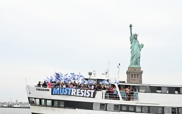 Anti-overhaul protesters rally on a boat by the Statue of Liberty in New York, July 7, 2023. (Roi Boshi/Courtesy) Anti-overhaul protesters rally on a boat by the Statue of Liberty in New York, July 7, 2023. (Roi Boshi/Courtesy)