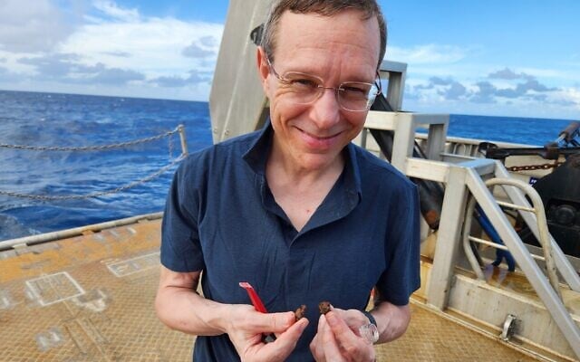 Prof. Avi Loeb, center, on a scientific expedition off of the coast of Papua New Guinea in June 2023 to identify parts of a possible interstellar meteor that crashed in 2014. (Courtesy of Loeb)