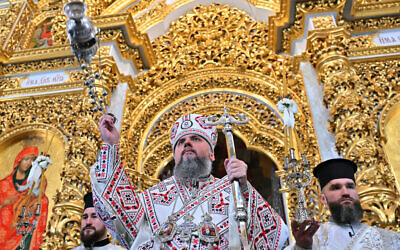 Serhiy Petrovytch Doumenko, Metropolitan Epifaniy of Kyiv, Head of Ukraine church, leads an Orthodox Christmas service at Kyiv Pechersk Lavra monastery in Kyiv on January 7, 2023. (Sergei Supinsky/AFP)