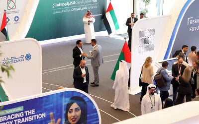 People attend the UAE Climate Tech Forum in Abu Dhabi, May 10, 2023. (Photo by Karim SAHIB / AFP)