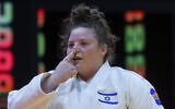 File: Raz Hershko celebrates after defeating China's Xu Shiyan (not pictured) during the women's +78Kg bronze medal bout at the World Judo Championship in Doha, Qatar, on May 13, 2023. (KARIM JAAFAR/AFP)
