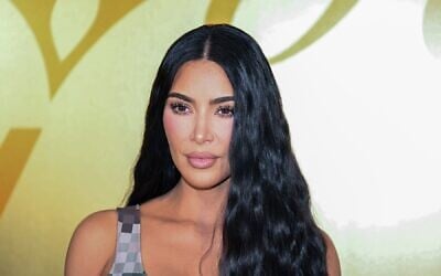 US socialite Kim Kardashian poses for a photo at the Louis Vuitton Menswear Spring-Summer 2024 show as part of the Paris Fashion Week, central Paris, on June 20, 2023. (STEFANO RELLANDINI / AFP)