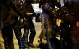 French police officers detain a demonstrator in Paris on July 2, 2023, five days after a 17-year-old man was killed by police in Nanterre, a western suburb of Paris. (Ludovic MARIN / AFP)