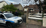 A municipal police officer stands in front of the damaged home of the mayor of l'Hay-les-Roses, Vincent Jeanbrun, in l'Hay-les-Roses, a suburb of Paris on July 2, 2023, after rioters rammed a vehicle into the building injuring the Mayor's wife and one of his children overnight, during continued disturbances across France after a 17-year-old man was killed by police in Nanterre, a western suburb of Paris on June 27. (Nassim GOMRI / AFP)