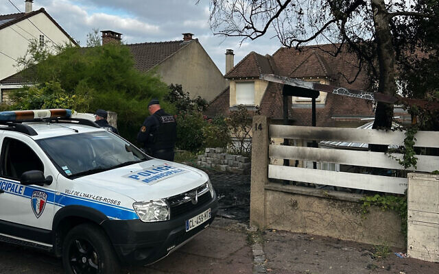A municipal police officer stands in front of the damaged home of the mayor of l'Hay-les-Roses, Vincent Jeanbrun, in l'Hay-les-Roses, a suburb of Paris on July 2, 2023, after rioters rammed a vehicle into the building injuring the Mayor's wife and one of his children overnight, during continued disturbances across France after a 17-year-old man was killed by police in Nanterre, a western suburb of Paris on June 27. (Nassim GOMRI / AFP) A municipal police officer stands in front of the damaged home of the mayor of l'Hay-les-Roses, Vincent Jeanbrun, in l'Hay-les-Roses, a suburb of Paris on July 2, 2023, after rioters rammed a vehicle into the building injuring the Mayor's wife and one of his children overnight, during continued disturbances across France after a 17-year-old man was killed by police in Nanterre, a western suburb of Paris on June 27. (Nassim GOMRI / AFP)