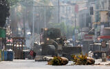 An Israeli army bulldozer drives through Jenin in the West Bank during a military operation on July 3, 2023. (Jaafar ASHTIYEH / AFP)