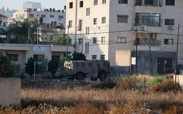 An Israeli armored vehicle drives through the West Bank city of Jenin on July 3, 2023 (Jaafar ASHTIYEH / AFP) An Israeli armored vehicle drives through the West Bank city of Jenin on July 3, 2023 (Jaafar ASHTIYEH / AFP)