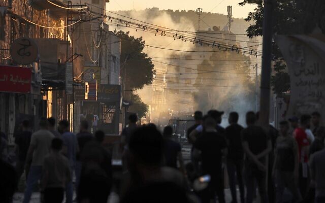 Palestinians clash with Israeli forces during a military operation in the Jenin refugee camp in the West Bank on July 3, 2023.(Jaafar ASHTIYEH / AFP)