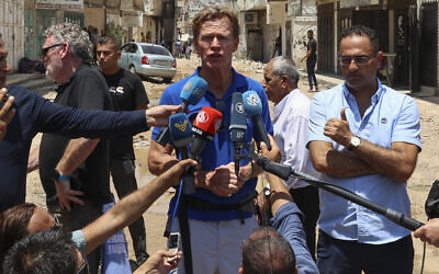European Union representative to the Palestinian territories Sven Kuehn von Burgsdorff speaks to reporters as he and a delegation of international envoys visit the Jenin refugee camp in the West Bank, on July 8, 2023. (Zain JAAFAR/AFP) European Union representative to the Palestinian territories Sven Kuehn von Burgsdorff speaks to reporters as he and a delegation of international envoys visit the Jenin refugee camp in the West Bank, on July 8, 2023. (Zain JAAFAR/AFP)