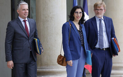 France's Culture Minister Rima Abdul-Malak (C), flanked by France's Minister for Solidarity, Autonomy and Persons with Disabilities Jean-Christophe Combe (L) and France's  Agriculture Minister Marc Fesneau, leaves the presidential Elysee Palace after attending the weekly cabinet meeting in Paris on July 13, 2023. (Photo by Geoffroy VAN DER HASSELT / AFP)