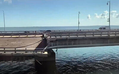 This video grab taken from Crimea24TV footage on July 17, 2023, shows the damaged Kerch bridge -- linking Crimea to Russia -- which was heavily damaged following an attack. (Crimea24TV/AFP)