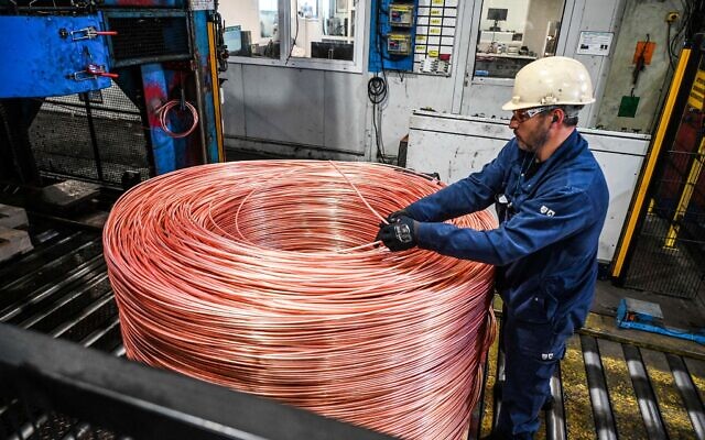 An employee monitors the 8mm diameter copper cable which is rolled up before passing through a rolling mill to become cable at the Nexans manufacture in Lens, northern France, on May 11, 2022. (Denis Charlet / AFP) An employee monitors the 8mm diameter copper cable which is rolled up before passing through a rolling mill to become cable at the Nexans manufacture in Lens, northern France, on May 11, 2022. (Denis Charlet / AFP)