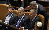 Prime Minister Benjamin Netanyahu (C) attends a parliament session in Jerusalem on July 24, 2023, amid a months-long wave of protests against the government's planned judicial overhaul. (Photo by RONALDO SCHEMIDT / AFP)
