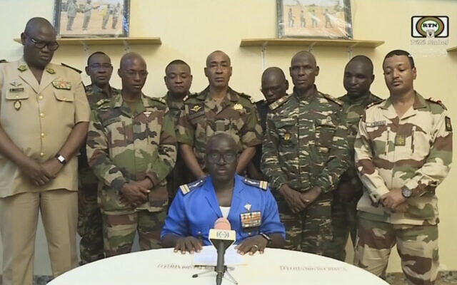 Colonel Major Amadou Abdramane (center), spokesperson for the National Committee for the Salvation of the People (CNSP), announces on TV that soldiers have overthrown the government of Niger's President Mohamed Bazoum, on July 26, 2023. (ORTN - Télé Sahel/AFP) Colonel Major Amadou Abdramane (center), spokesperson for the National Committee for the Salvation of the People (CNSP), announces on TV that soldiers have overthrown the government of Niger's President Mohamed Bazoum, on July 26, 2023. (ORTN - Télé Sahel/AFP)