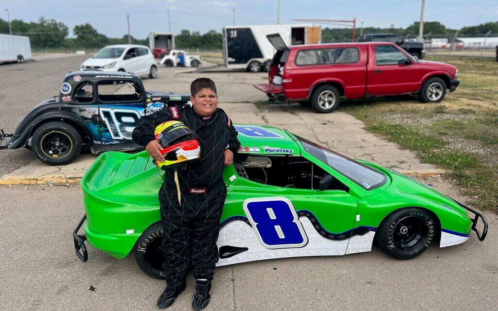 Thomas Poretsky shown in front of his Bandolero car. (Lonny Goldsmith/TC Jewfolk via JTA)