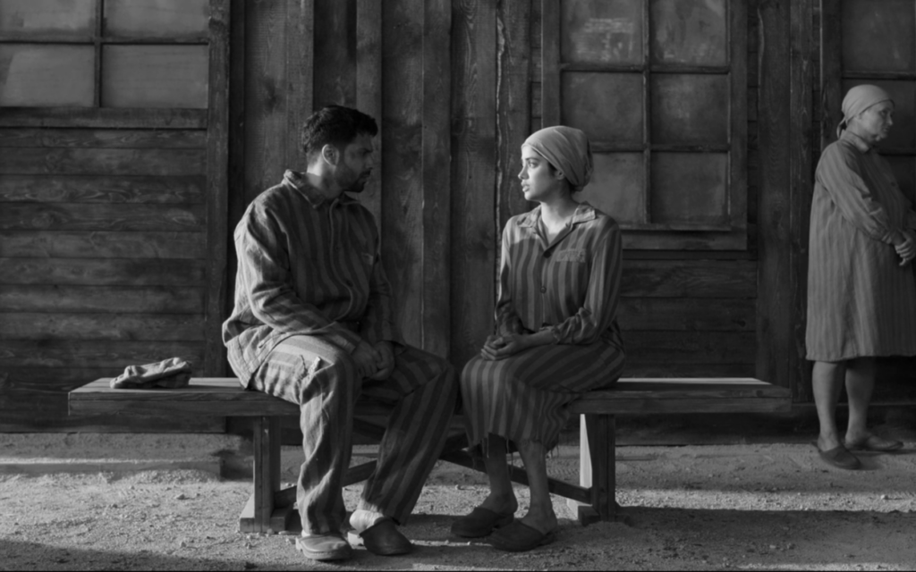 Ajay (Varun Dhawan) and Nisha (Janhvi Kapoor) imagine themselves as Auschwitz prisoners in a scene from the Amazon-distributed 'Bawaal.' (Screenshot via JTA) Ajay (Varun Dhawan) and Nisha (Janhvi Kapoor) imagine themselves as Auschwitz prisoners in a scene from the Amazon-distributed 'Bawaal.' (Screenshot via JTA)